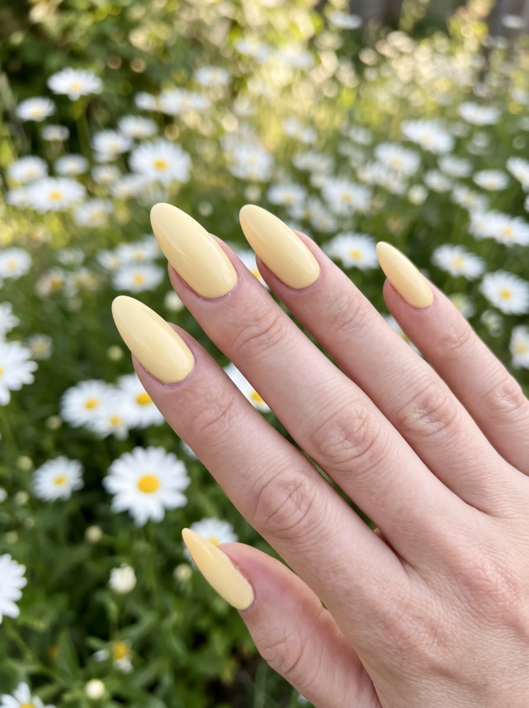 10 best spring nails featuring creamy butter yellow polish on almond shapes