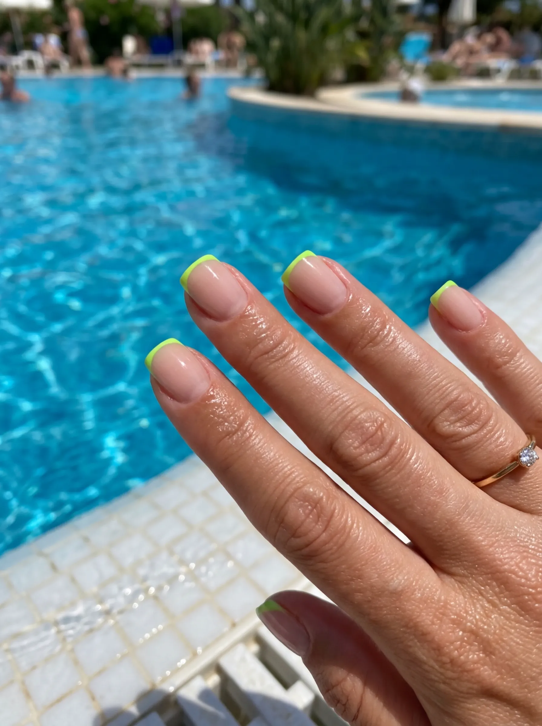 Neon French tip summer nail designs 2026 on short square nails.